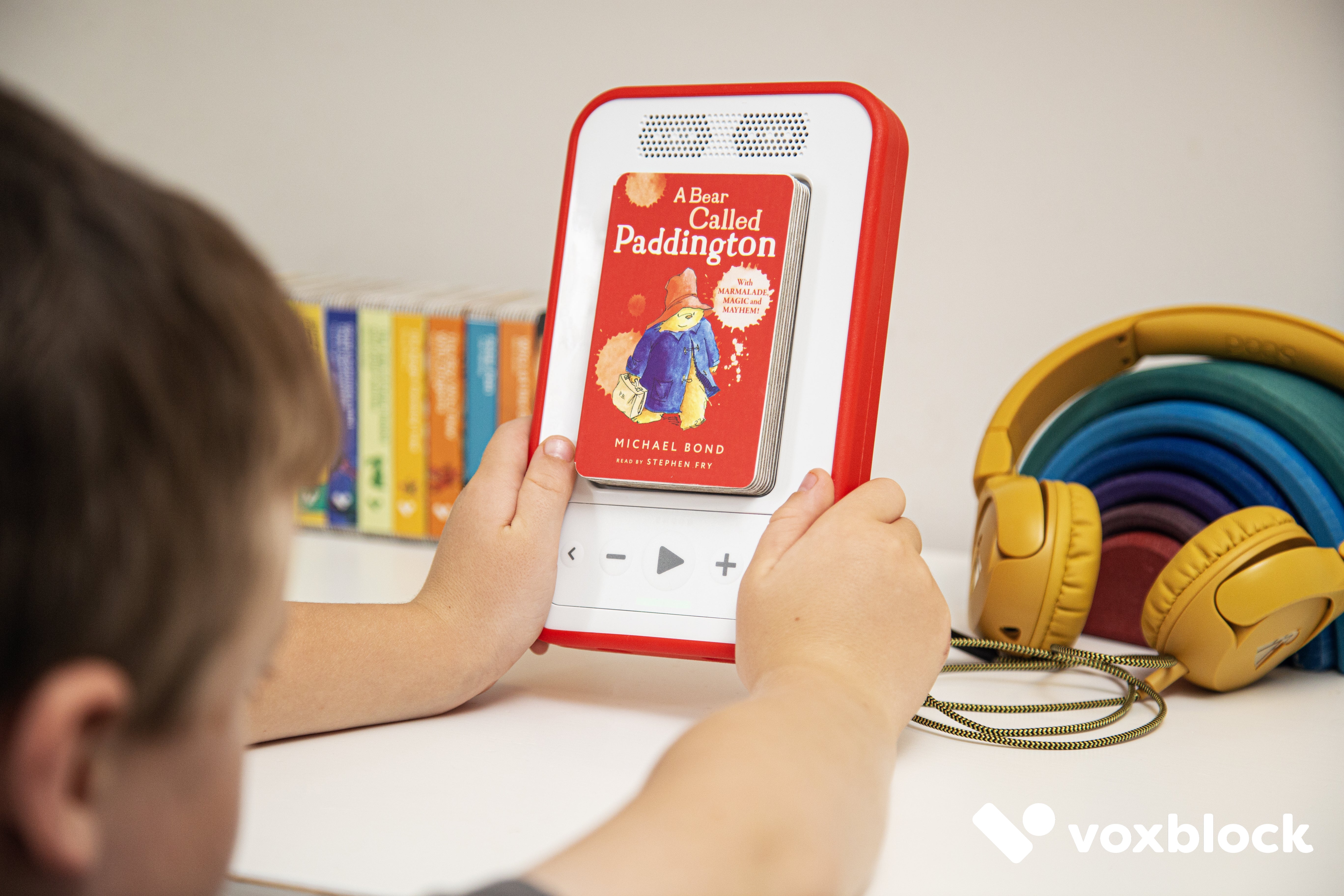 boy holding voxblock audio player