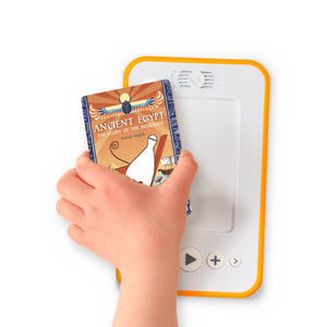 A hand holding the audiobook card for Ancient Egypt – The Glory of the Pharaohs beside a Voxblock audiobook player