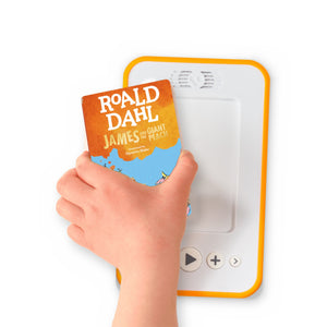 A hand holding the audiobook card for James and the Giant Peach beside a Voxblock audiobook player