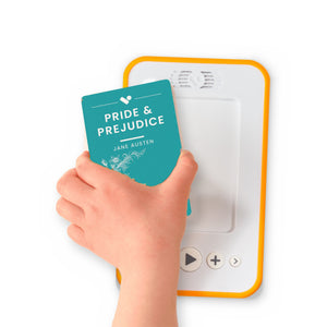 A hand holding the audiobook card for Pride and Prejudice beside a Voxblock audiobook player