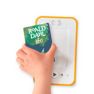 A hand holding the audiobook card for The BFG beside a Voxblock audiobook player