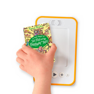 A hand holding the audiobook card for The Folk of the Faraway Tree beside a Voxblock audiobook player