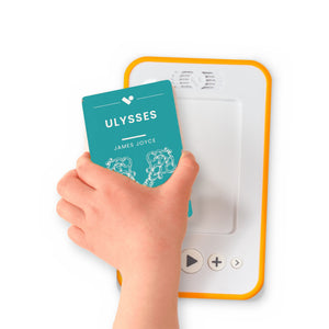 A hand holding the audiobook card for Ulysses beside a Voxblock audiobook player