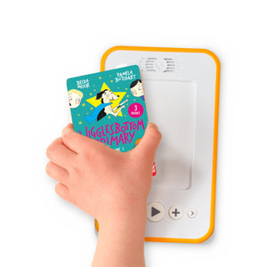 A hand holding the audiobook card for Wigglesbottom Primary Vol. 2 beside a Voxblock audiobook player