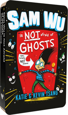 Front view of ‘Sam Wu is Not Afraid of Ghosts’ Voxblock, a physical audiobook made of layers of card, about the size of a cassette. Cover art shows young boy with glasses, struggling to hold back a red door, while scary faces watch him from the surrounding darkness.