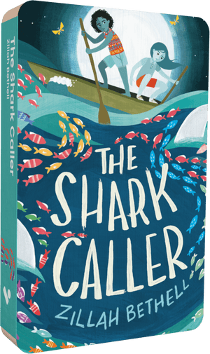 Front view of ‘The Shark Caller’ Voxblock, a physical audiobook made of layers of card, about the size of a cassette. Cover art shows two young grill paddling a boat, above shoals of colourful fish.