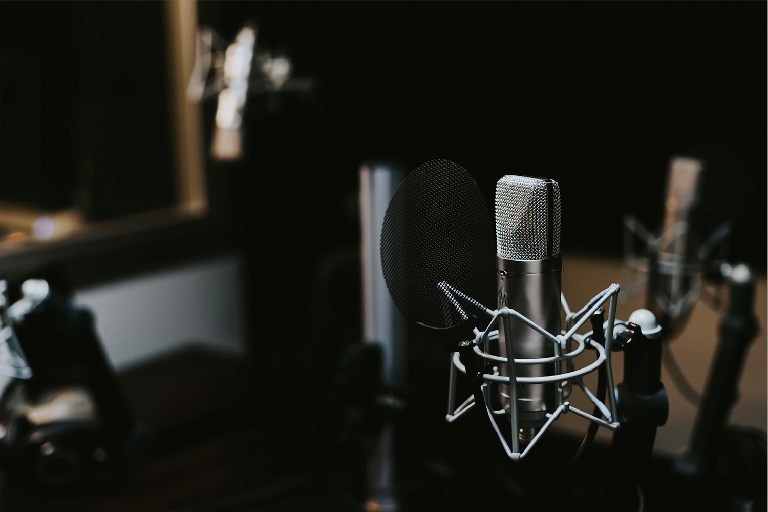 Close up of a microphone in a recording studio.