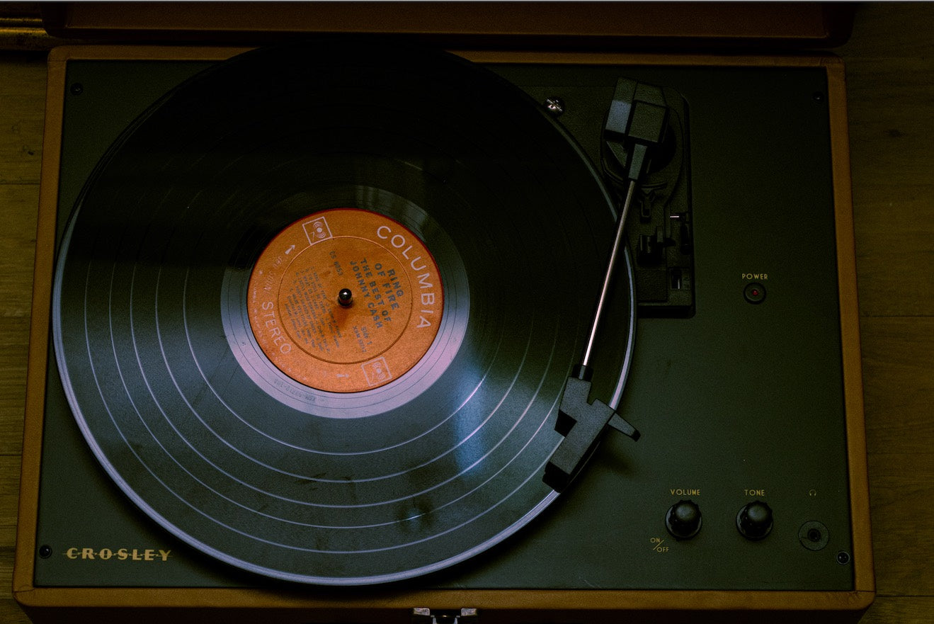 A record player and vinyl, symbolising the origins of tangible audio.