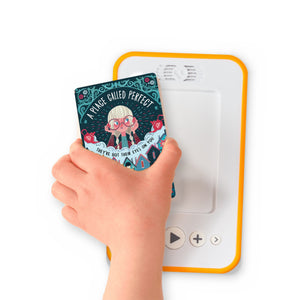 A hand holding the audiobook card for A Place Called Perfect beside a Voxblock audiobook player