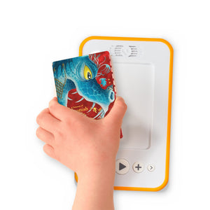 A hand holding the audiobook card for A Treasury of Scottish Castle Legends beside a Voxblock audiobook player