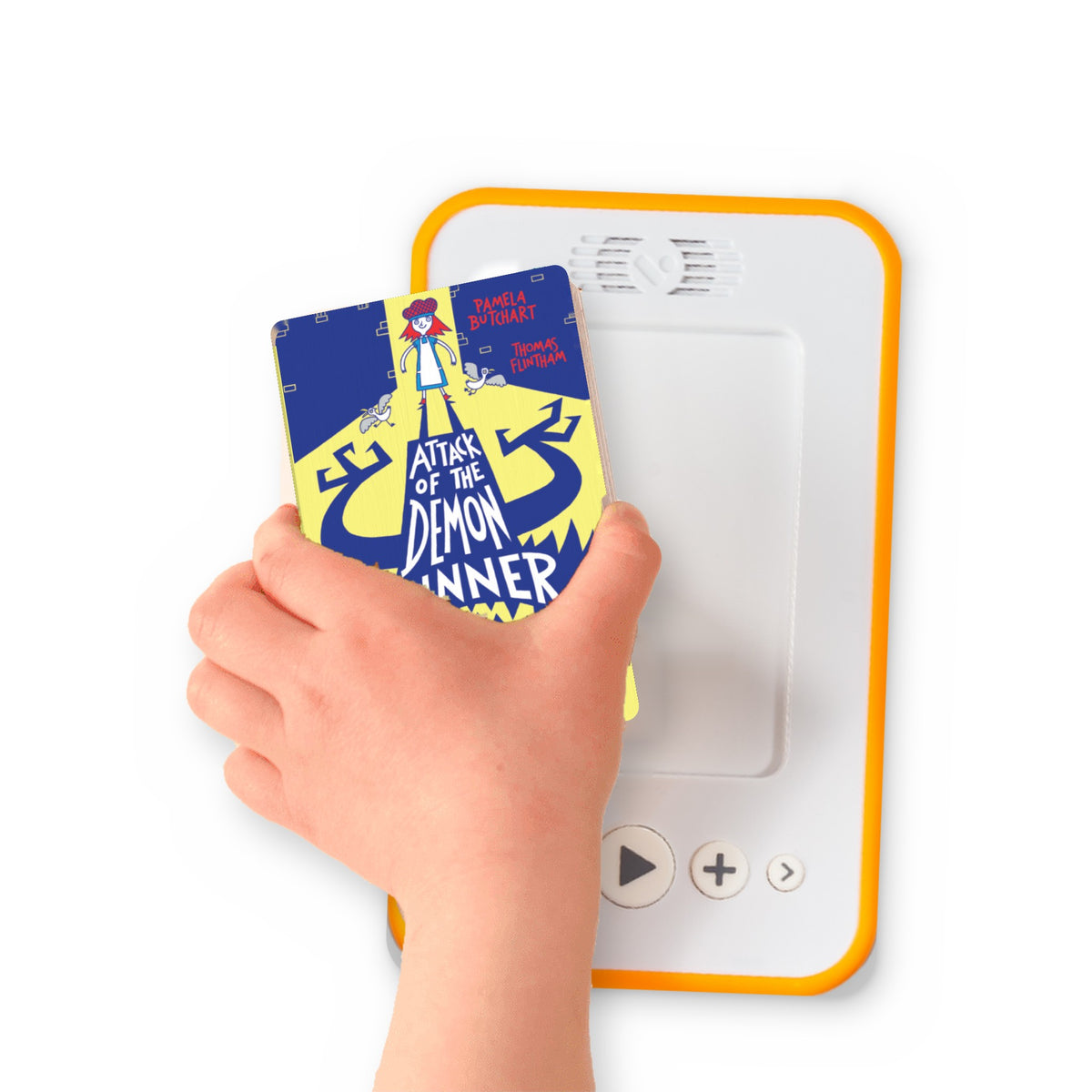 A hand holding the audiobook card for Attack of the Demon Dinner Ladies beside a Voxblock audiobook player