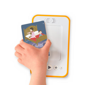 A hand holding the audiobook card for Bedtime Meditations for Kids beside a Voxblock audiobook player