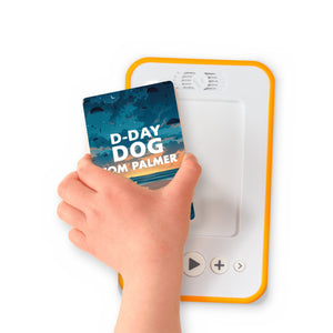 A hand holding the audiobook card for D-Day Dog beside a Voxblock audiobook player