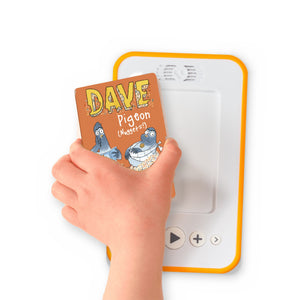 A hand holding the audiobook card for Dave Pigeon: Nuggets! beside a Voxblock audiobook player