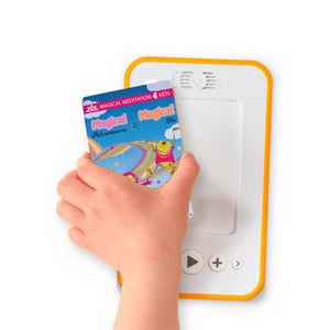 A hand holding the audiobook card for Magical Adventures & Magical Me beside a Voxblock audiobook player