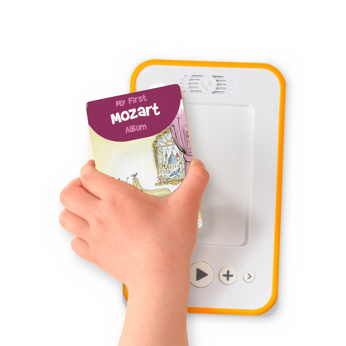 A hand holding the audiobook card for My First Mozart Album beside a Voxblock audiobook player