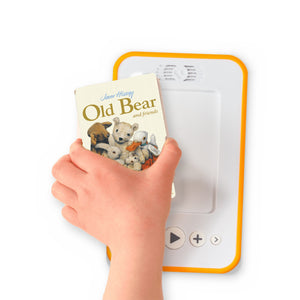 A hand holding the audiobook card for Old Bear and Friends beside a Voxblock audiobook player