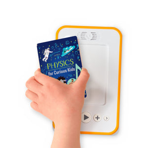 A hand holding the audiobook card for Physics for Curious Kids beside a Voxblock audiobook player