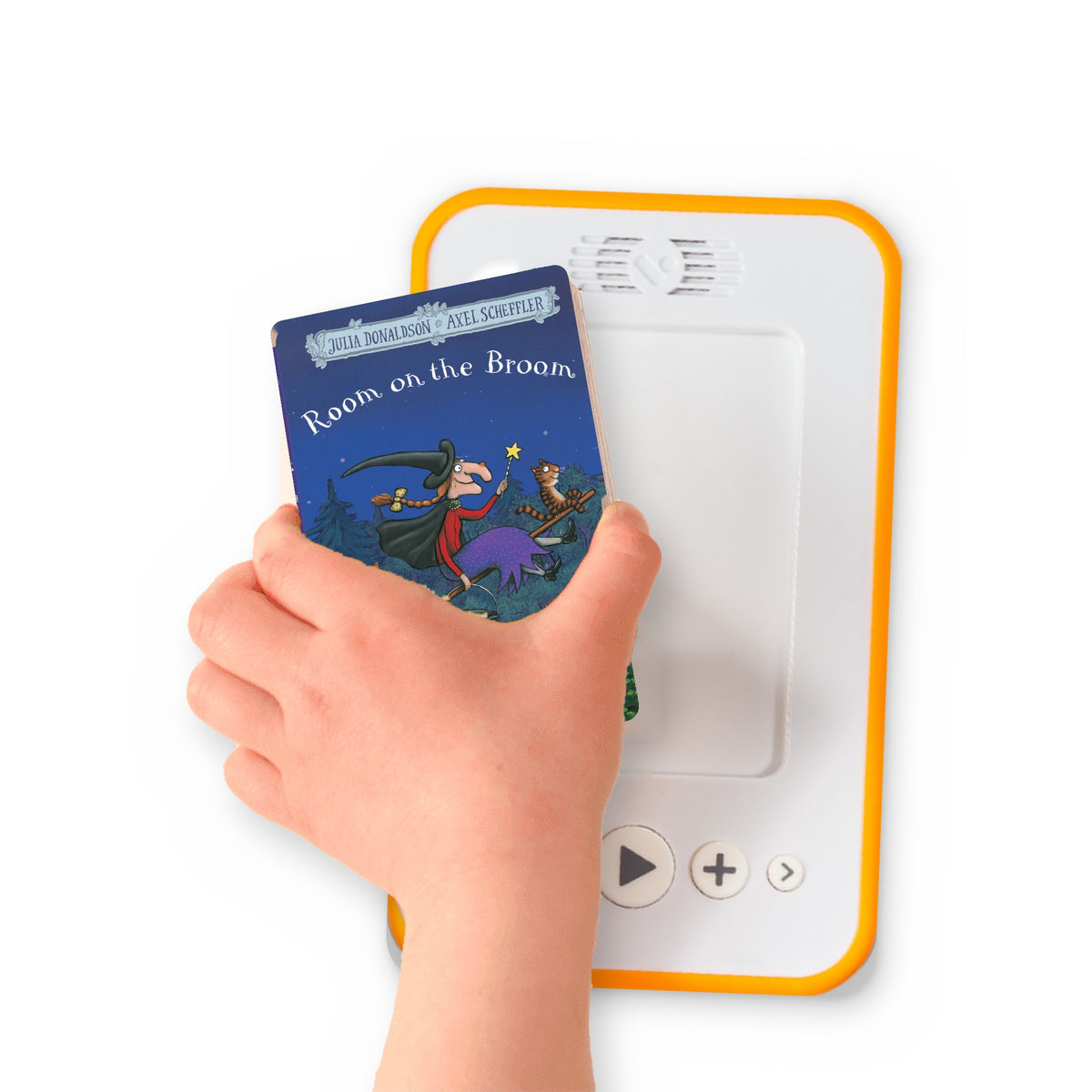 A hand holding the audiobook card for Room on the Broom beside a Voxblock audiobook player