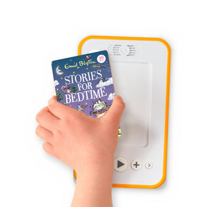 A hand holding the audiobook card for Stories for Bedtime beside a Voxblock audiobook player