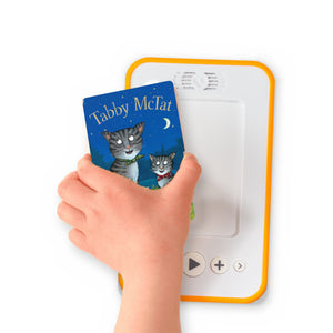 A hand holding the audiobook card for Tabby McTat beside a Voxblock audiobook player