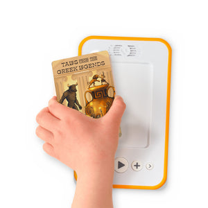 A hand holding the audiobook card for Tales from the Greek Legends beside a Voxblock audiobook player