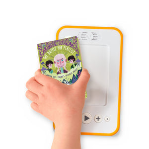A hand holding the audiobook card for The Battle for Perfect beside a Voxblock audiobook player