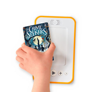 A hand holding the audiobook card for The Chime Seekers beside a Voxblock audiobook player