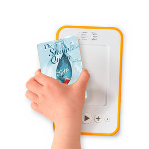 A hand holding the audiobook card for The Snow Queen and Other Stories beside a Voxblock audiobook player