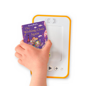 A hand holding the audiobook card for The Wishing Chair Again beside a Voxblock audiobook player