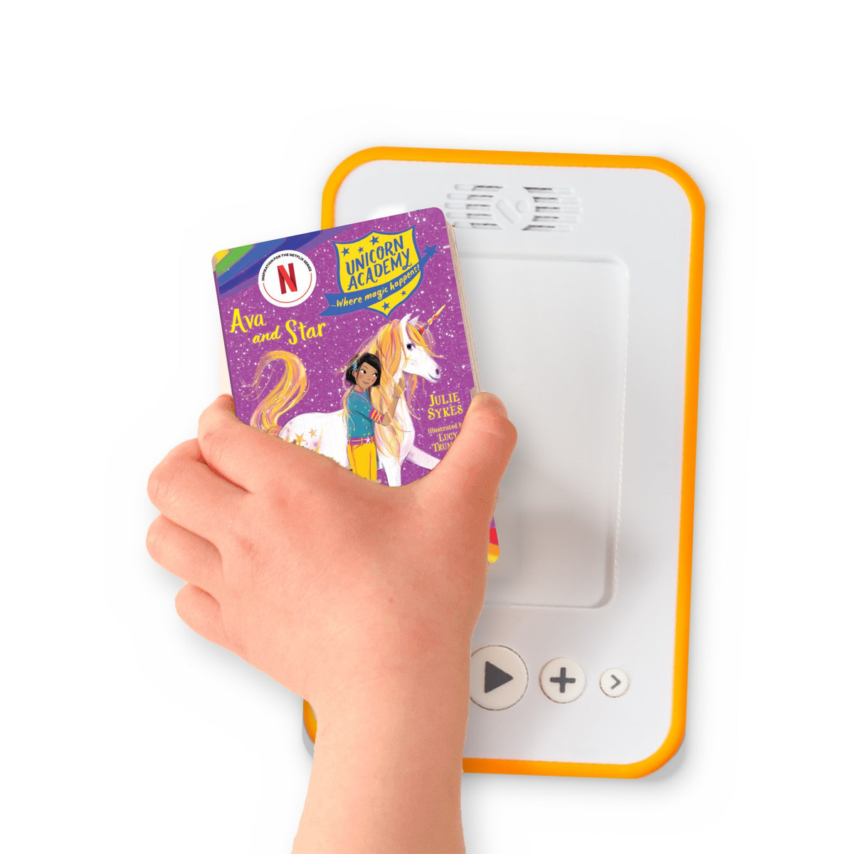 A hand holding the audiobook card for Unicorn Academy: Ava and Star beside a Voxblock audiobook player