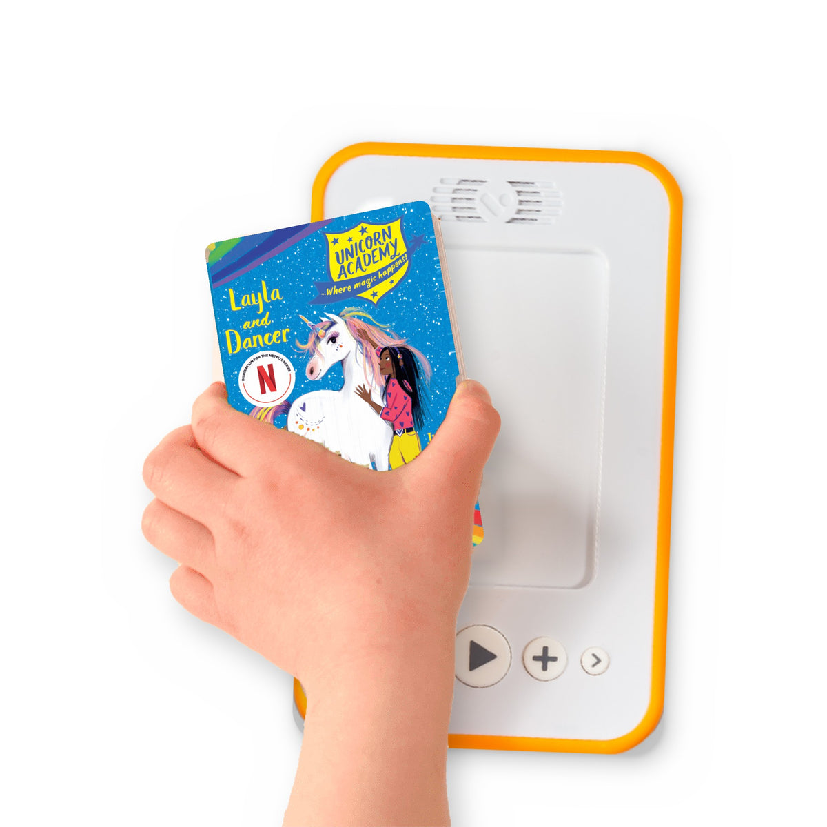 A hand holding the audiobook card for Unicorn Academy: Layla and Dancer beside a Voxblock audiobook player