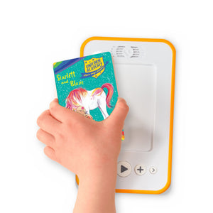 A hand holding the audiobook card for Unicorn Academy: Scarlett and Blaze beside a Voxblock audiobook player