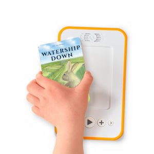 A hand holding the audiobook card for Watership Down beside a Voxblock audiobook player