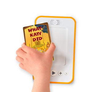 A hand holding the audiobook card for What Katy Did beside a Voxblock audiobook player