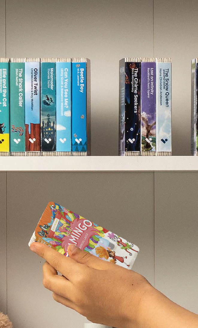 A hand taking the Hotel Flamingo: Carnival Caper audiobook from a shelf of Voxblock audiobooks