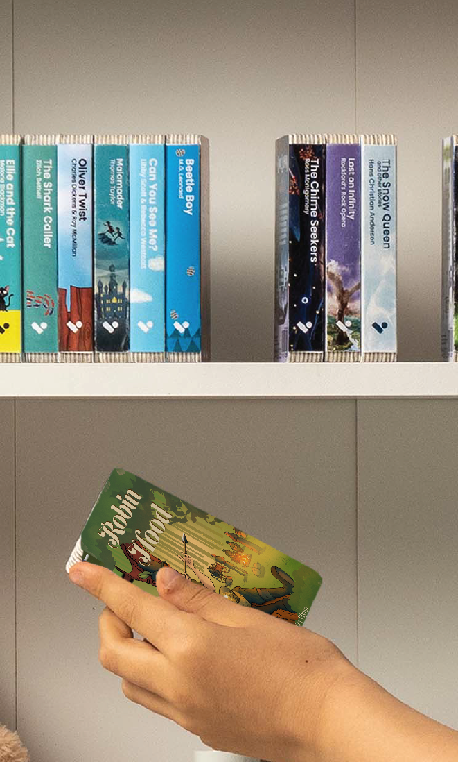 A hand taking the Robin Hood audiobook from a shelf of Voxblock audiobooks