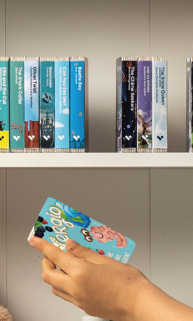 A hand taking the Sergio the Snail: Eco-Agent audiobook from a shelf of Voxblock audiobooks