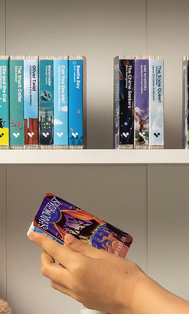 A hand taking the Shadowghast audiobook from a shelf of Voxblock audiobooks