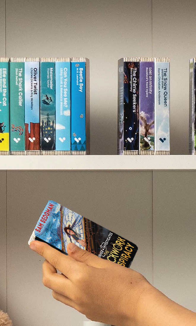A hand taking The Clockwork Conspiracy audiobook from a shelf of Voxblock audiobooks