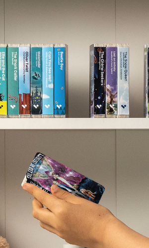 A hand taking The End of Infinity audiobook from a shelf of Voxblock audiobooks