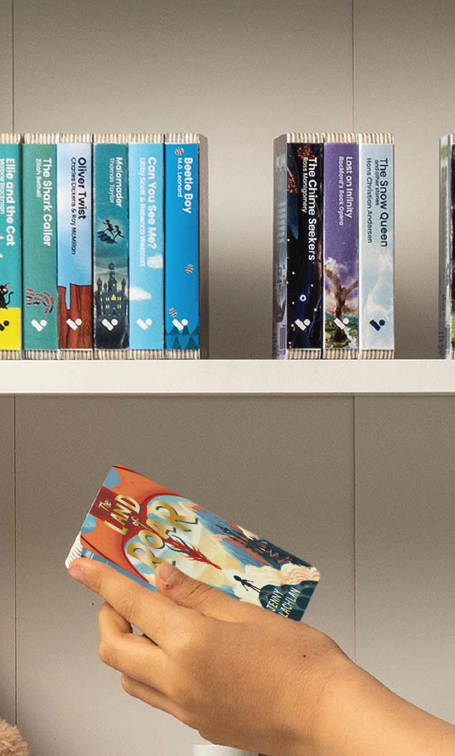 A hand taking The Land of Roar audiobook from a shelf of Voxblock audiobooks