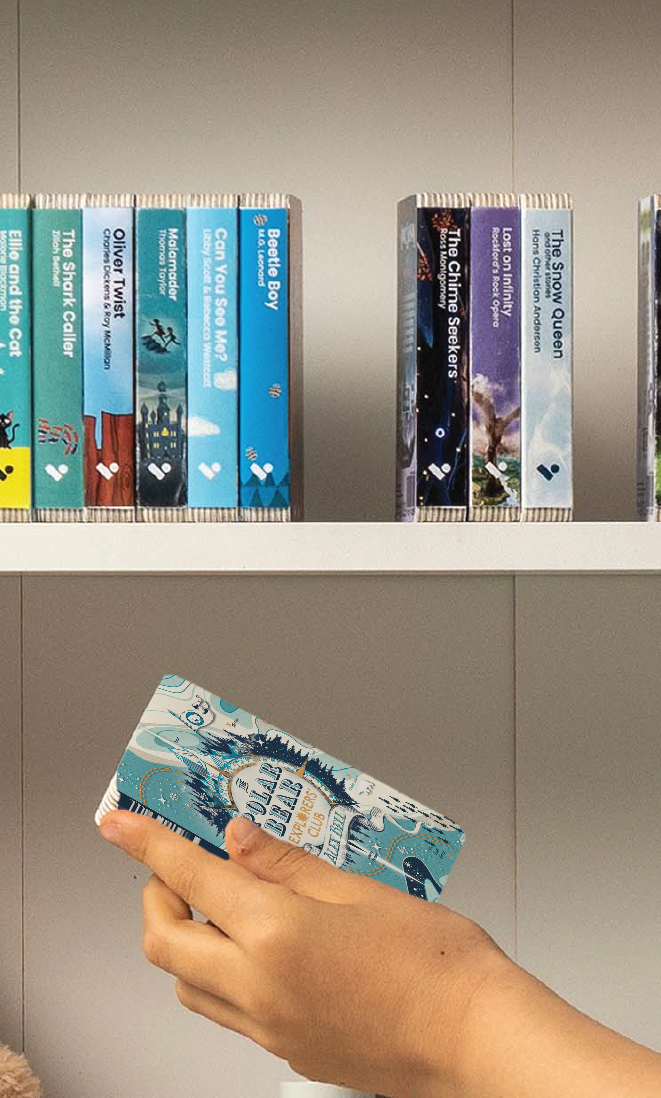 A hand taking The Polar Bear Explorers' Club audiobook from a shelf of Voxblock audiobooks