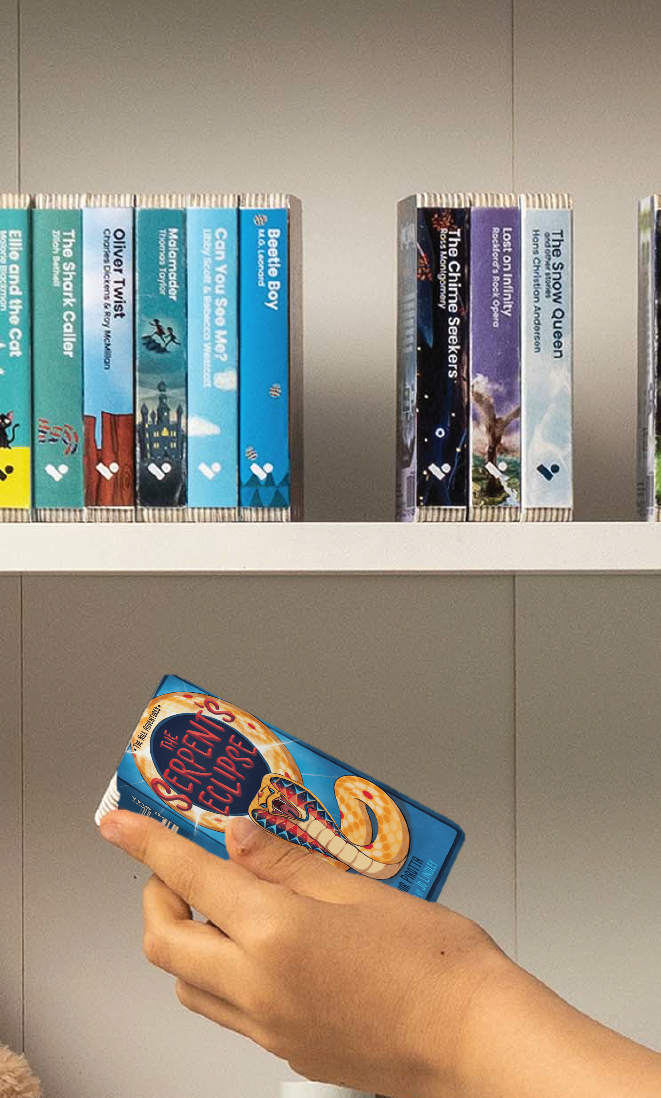 A hand taking The Serpent's Eclipse audiobook from a shelf of Voxblock audiobooks