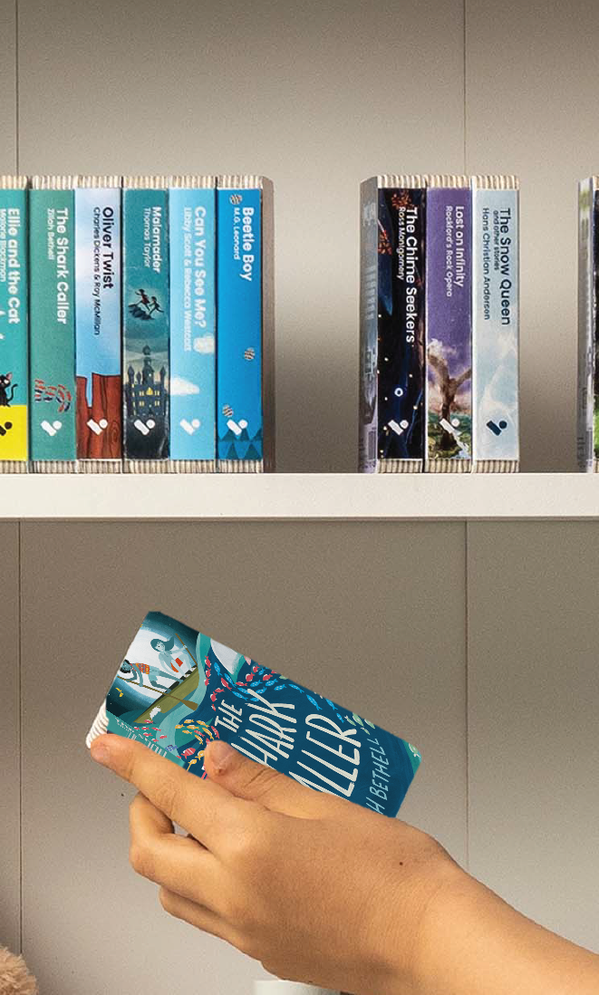 A hand taking The Shark Caller audiobook from a shelf of Voxblock audiobooks