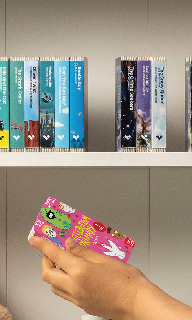 A hand taking the Wigglesbottom Primary Vol. 3 audiobook from a shelf of Voxblock audiobooks