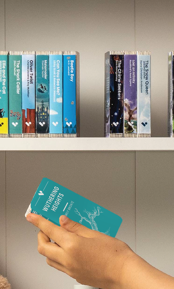 A hand taking the Wuthering Heights audiobook from a shelf of Voxblock audiobooks