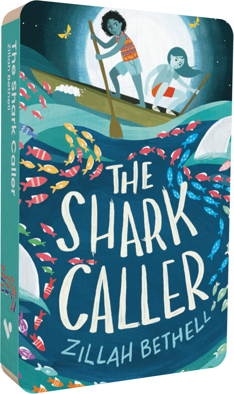 Front view of ‘The Shark Caller’ Voxblock, a physical audiobook made of layers of card, about the size of a cassette. Cover art shows two young grill paddling a boat, above shoals of colourful fish.